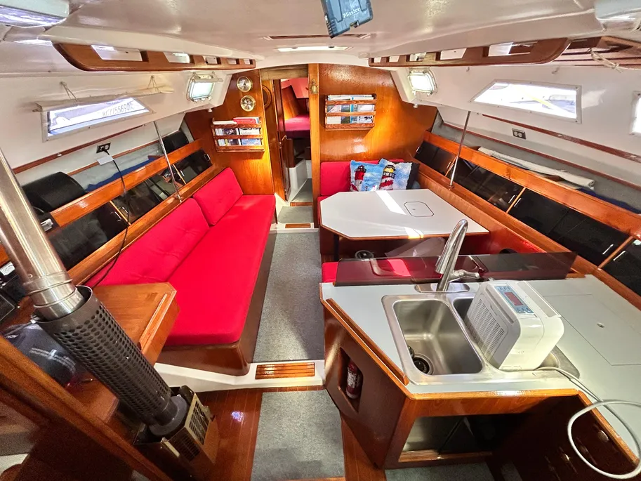 The main cabin features an unusual athwartships dinette arrangement instead of the more common U-shape. Courtesy of YachtWorld