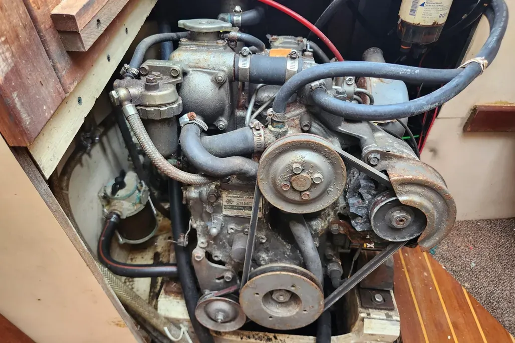 Engine accessibility varies dramatically between the aft and center cockpit models. While serviceable, the center cockpit version presents challenges for routine maintenance, with owners frequently complaining about difficulty reaching one side of the engine and accessing the dipstick. Courtesy of YachtWorld.com
