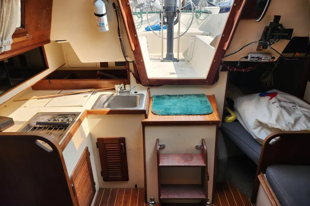 S2's signature fabric hull liner, shown here in the neutral polypropylene treatment, became almost a trademark of S2 interiors. Many owners eventually become fans of the material's durability and resistance to mildew and stains—though a good wet/dry vacuum becomes essential maintenance equipment. Courtesy of Yachtworld.com