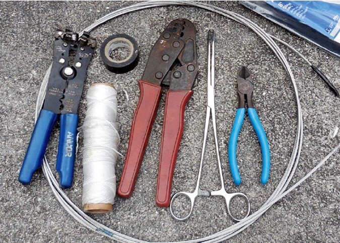 p1alavd36l19qf1isk1f55c2f877a Essential tools for rewriting (left to right): fish tape, RJ45 crimping toolelectrician's tape, 10 pound mason's line (pull string), 1 insulated terminal crimping pliers, long-jawed hemostat, and wire cutters.