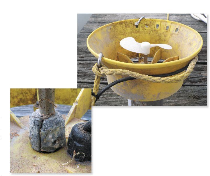 A propeller-driven deicer suspended with proper 3/8-in. nylon rope and chafe protection (top). The close-up (bottom) shows a corroded shaft anode after several seasons of use—essential protection that prevents galvanic corrosion of the motor shaft and housing. Anodes should be inspected regularly and replaced when significantly deteriorated.