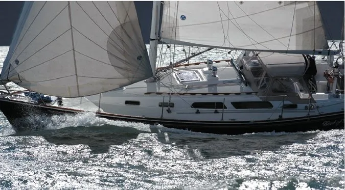 Sailing to windward with full canvas set, this cruising yacht demonstrates the importance of proper sail trim and balanced rig configuration for maintaining boat speed while minimizing leeway. (Photo/ Ralph Naranjo)