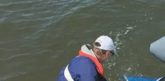 Testers were always tethered to the boat, even in light weather. In heavy weather, two hands are required to manhandle drogues and the deck is moving; the tether saved us from going over many times. A bucket lashed to the stern rain was handy for handling chain rode without scratching gelcoat.