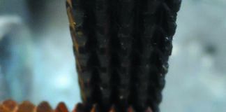 Straightening 1-inch pipe threads using a General Tools thread restoring file. To use the file, align the file with threads, and work from good threads outwards, so that several of the rows of teeth are always engaged with good threads. Use moderate pressure; enough to keep the file from skipping, but not enough to cut deeply into the pipe or bolt. Take your time. Clean with wire brush when finished.