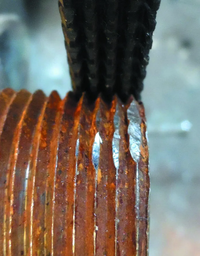 10. damamged threads 2a Straightening 1-inch pipe threads using a General Tools thread restoring file. To use the file, align the file with threads, and work from good threads outwards, so that several of the rows of teeth are always engaged with good threads. Use moderate pressure; enough to keep the file from skipping, but not enough to cut deeply into the pipe or bolt. Take your time. Clean with wire brush when finished.