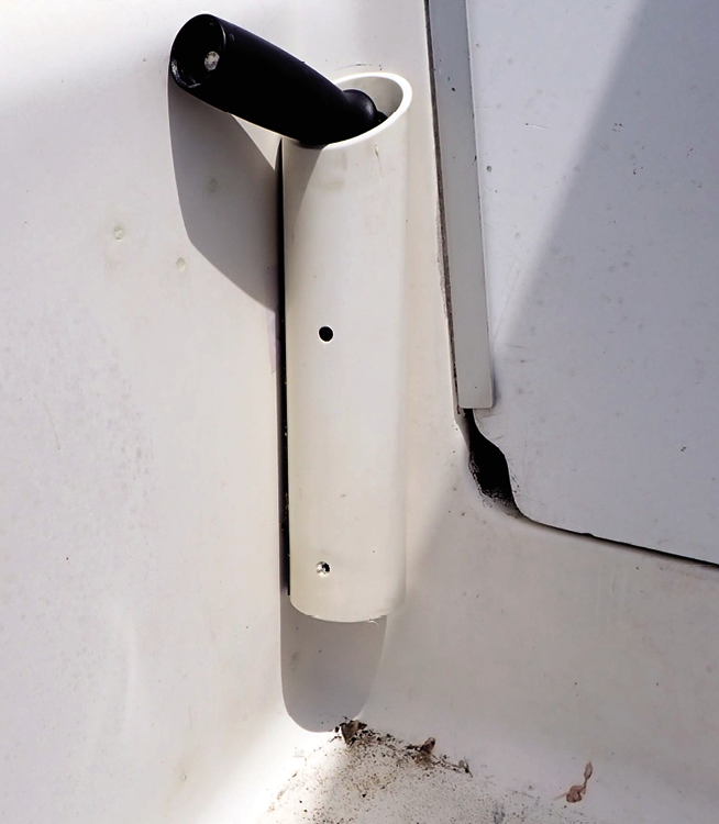 Mailport winch handle holders; pets on board Practical Sailor