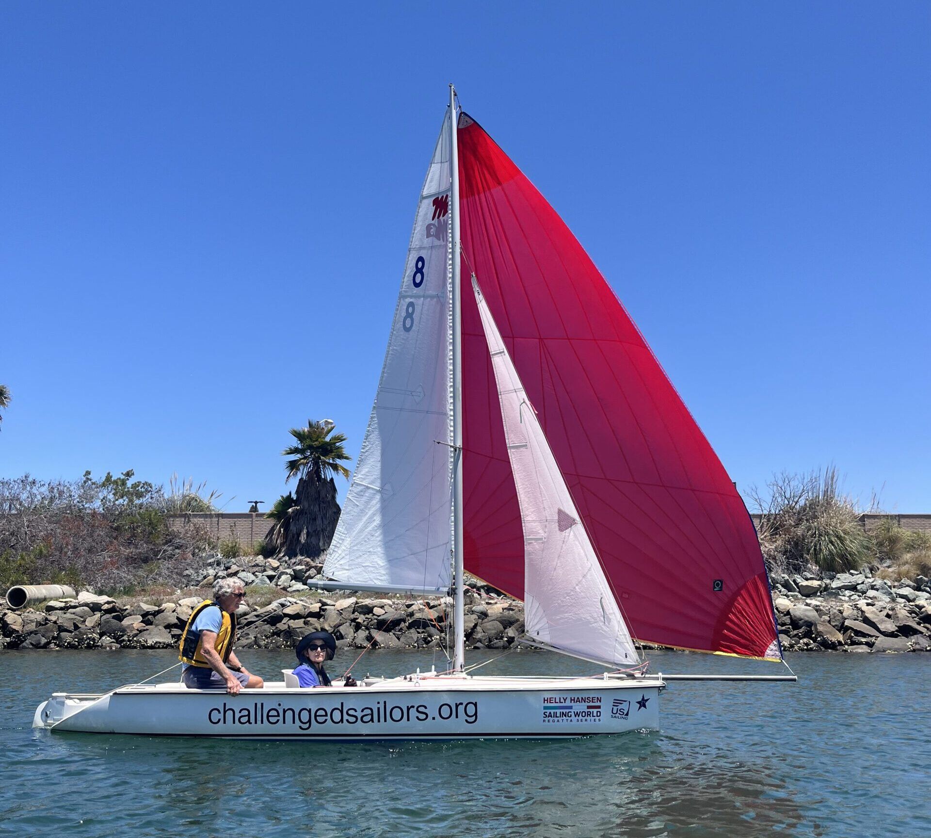 Martin 16 with mainsail, jib and asymmetric spinnaker flying. The boom is just high enough to avoid hitting people on the head. (Photo/ Steven Vitela)