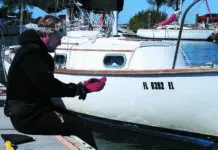 Bottom Paint Care A professional cleaner prepares to dive on one of our former bottom paint test boats, a Cape Dory 28.