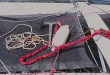 Your get-home jury-rig won't be pretty. It consists of a bridle line (spinnaker sheet works nicely), a length of chain to keep the drogue submerged, and a series of fenders to aid recovery.