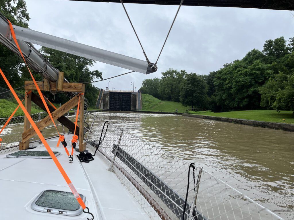 This is one of the locks near the beginning of the Erie Canal (Locks E-2 to E-6) in Waterford, NY. Because there are five locks in a row, it's sometimes referred to as the "Flight of Five." Fika's mast is secured in the wood cradles on the deck. Most of the locks on the Erie Canal are automatic and there are signs about how to contact the lockmaster. Often, the first lockmaster will ask how far you intend to travel that day and will inform the next lockmasters on your route about your approximate arrival time. You can check www.canals.ny.gov to learn about any lock updates that may impact your plans. (Photo/ Alison Major)