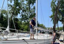 The crew at Hop-O-Nose Marina in Catskill, NY helped us remove our mast. They also helped us build cradles on the deck so that we could carry our mast and rigging on deck as we traveled the Erie Canal. (Photo/ Alison Major)