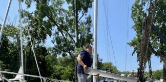 The crew at Hop-O-Nose Marina in Catskill, NY helped us remove our mast. They also helped us build cradles on the deck so that we could carry our mast and rigging on deck as we traveled the Erie Canal. (Photo/ Alison Major)