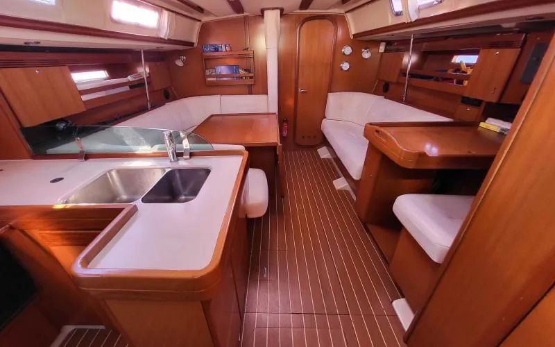 The Dufour 44 interior features an all handsome wood-look, a welcome break from the often synthetic feeling of modern production boats. Image courtesy of Yacht World.