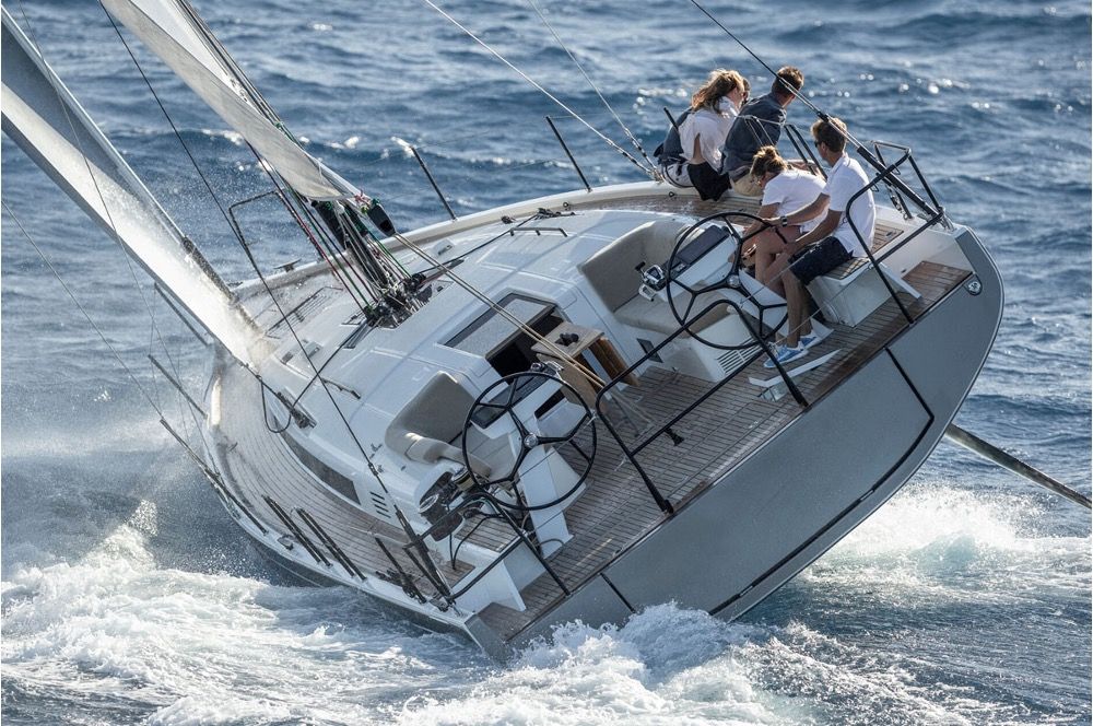 The Beneteau First 44 going full tilt to windward. Notice how much of the windward side of the hull is clear of the water, if fact the root of the keel is probably clear of the water. It is also clear why this design needs twin rudders, the windward one is completely clear of the water. Photo courtesy of RCR Yachts.