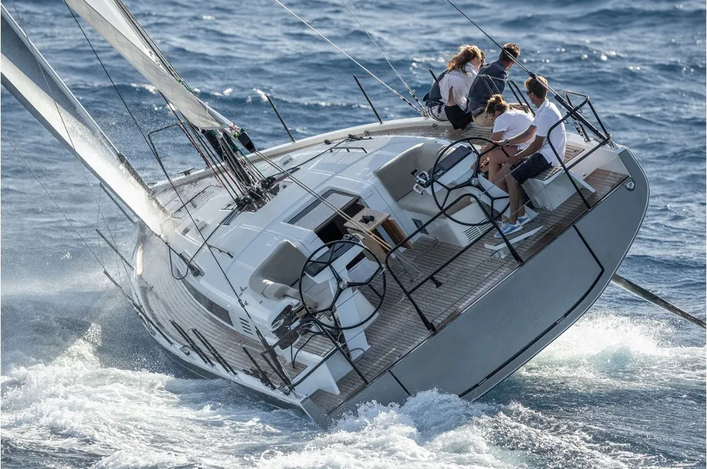 The Beneteau First 44 going full tilt to windward. Notice how much of the windward side of the hull is clear of the water, if fact the root of the keel is probably clear of the water. It is also clear why this design needs twin rudders, the windward one is completely clear of the water. Photo courtesy of RCR Yachts.