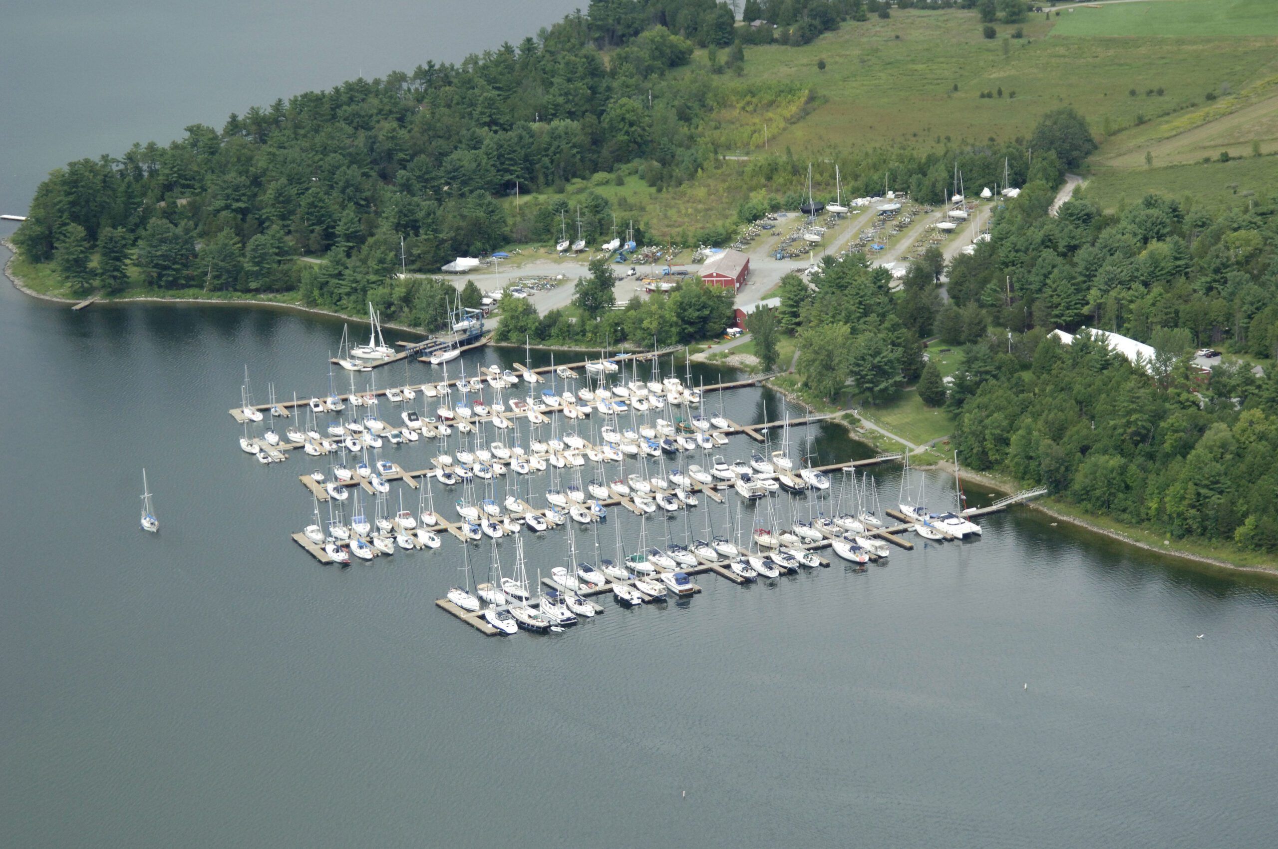 Safe Harbor Marina in Wilsboro, New-York on Lake Champlain. Northern Lake Champlain, flanked by New-York to the west and Vermont to the east, is home to many marinas and yacht clubs that are occupied by many Canadians who leave their boat there all season. You can easily cross the border by land or sea to enjoy sailing this wonderful body of water. Lake Champlain also provides sailors access to travel south via the Hudson River and the world beyond. You can also make your way north to Canada and the St-Lawrence Seaway. 