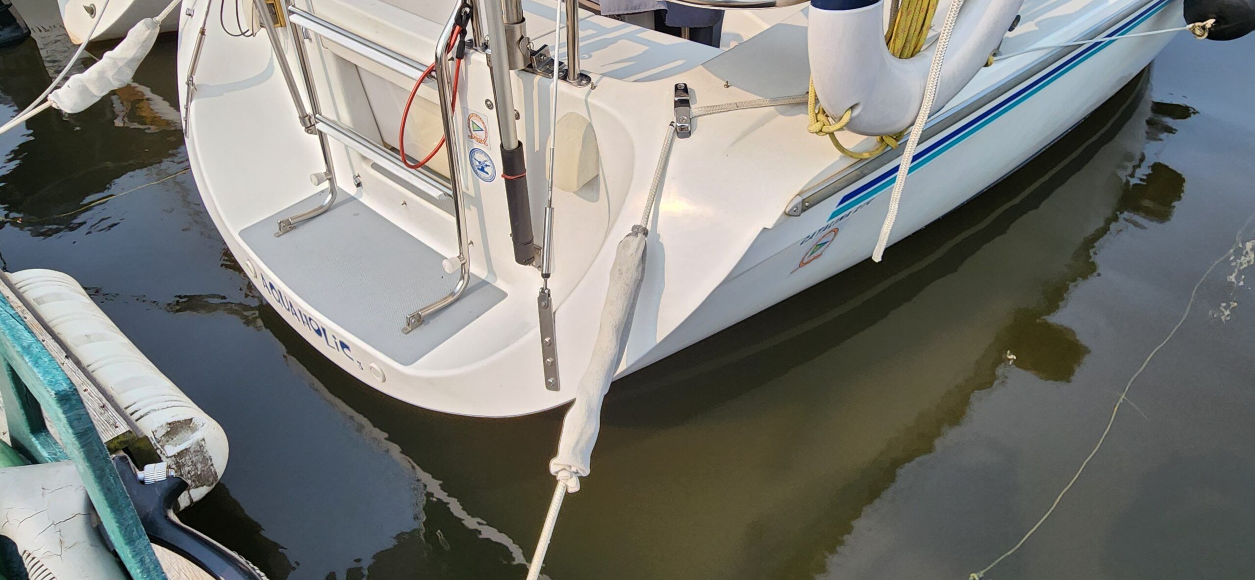 While you can adjust the shock absorbers to be closer to the dock to keep them from marking the hull, you can also cover them in plan, white socks. (Photo/ Marc Robic)