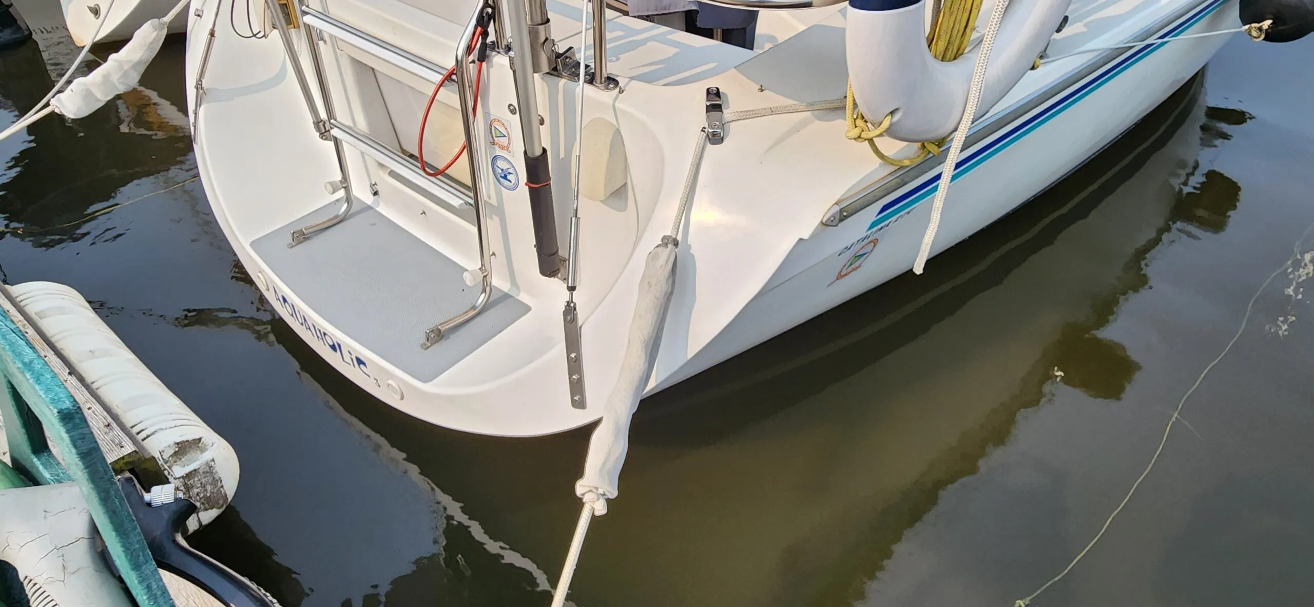 While you can adjust the shock absorbers to be closer to the dock to keep them from marking the hull, you can also cover them in plan, white socks. (Photo/ Marc Robic)