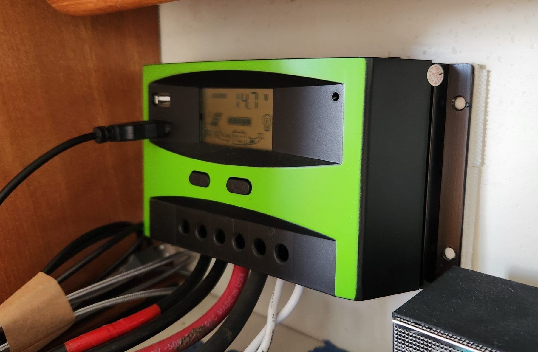 Solar controller secured to inside hull with 1.5 Velcro strips on each edge. (Photo/ Marc Robic)