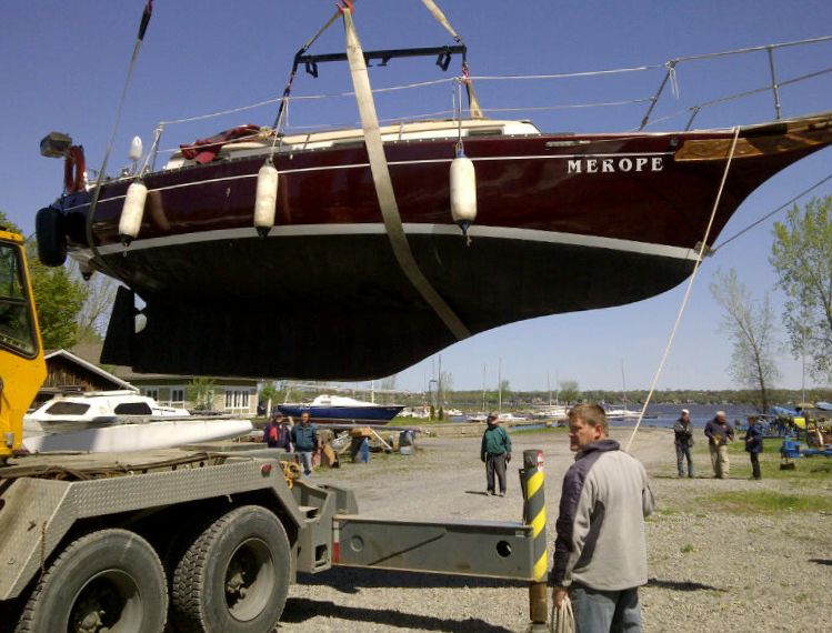 Full keel boats require special attention and caution. In the fall, when slime has built up on the surface of the hull and keel, it is good practice to tie the slings together once the boat is out and before traveling. This will prevent the forward sling from sliding off the bow. (Photo/ Marc Robic) 