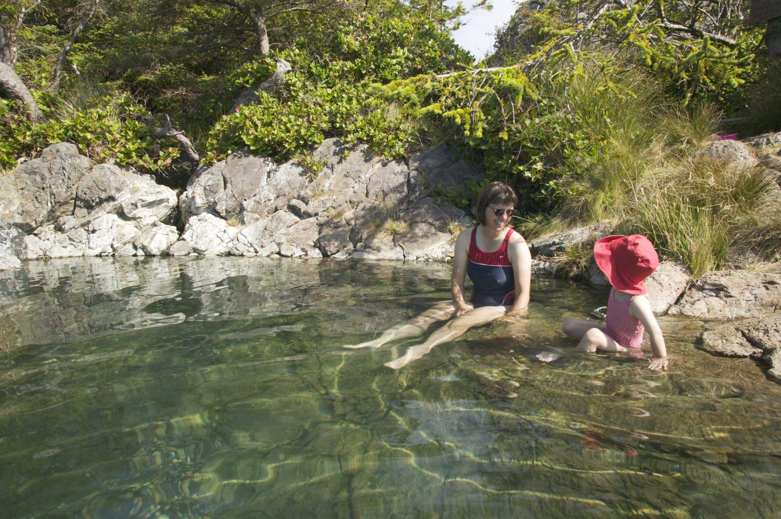While ocean temps are brisk to frigid year-round, sail towards hot springs throughout the PNW for a welcome soak. Hotsprings on Hotspring Island (Gandl K'in Gwaayaay) in Gwaii Haanas National Park Reserve, British Columbia, Canada. (Photo/ Lucidio Studio, Inc./ Getty Images)