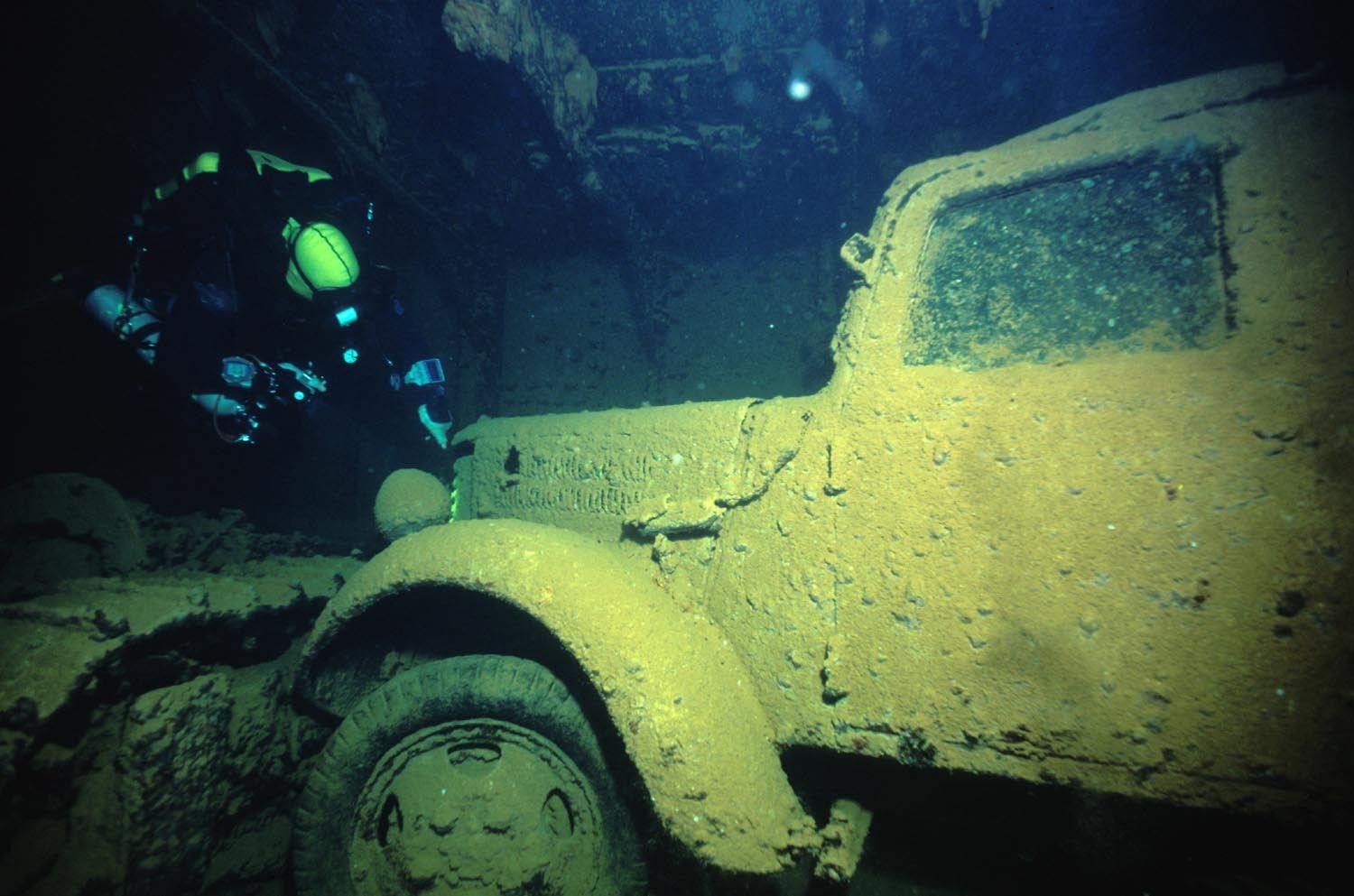 Eric Keibler posing next to a Nissan truck on the Hoki Maru in Chuuk FSM. (Photo/ Eric Keibler)