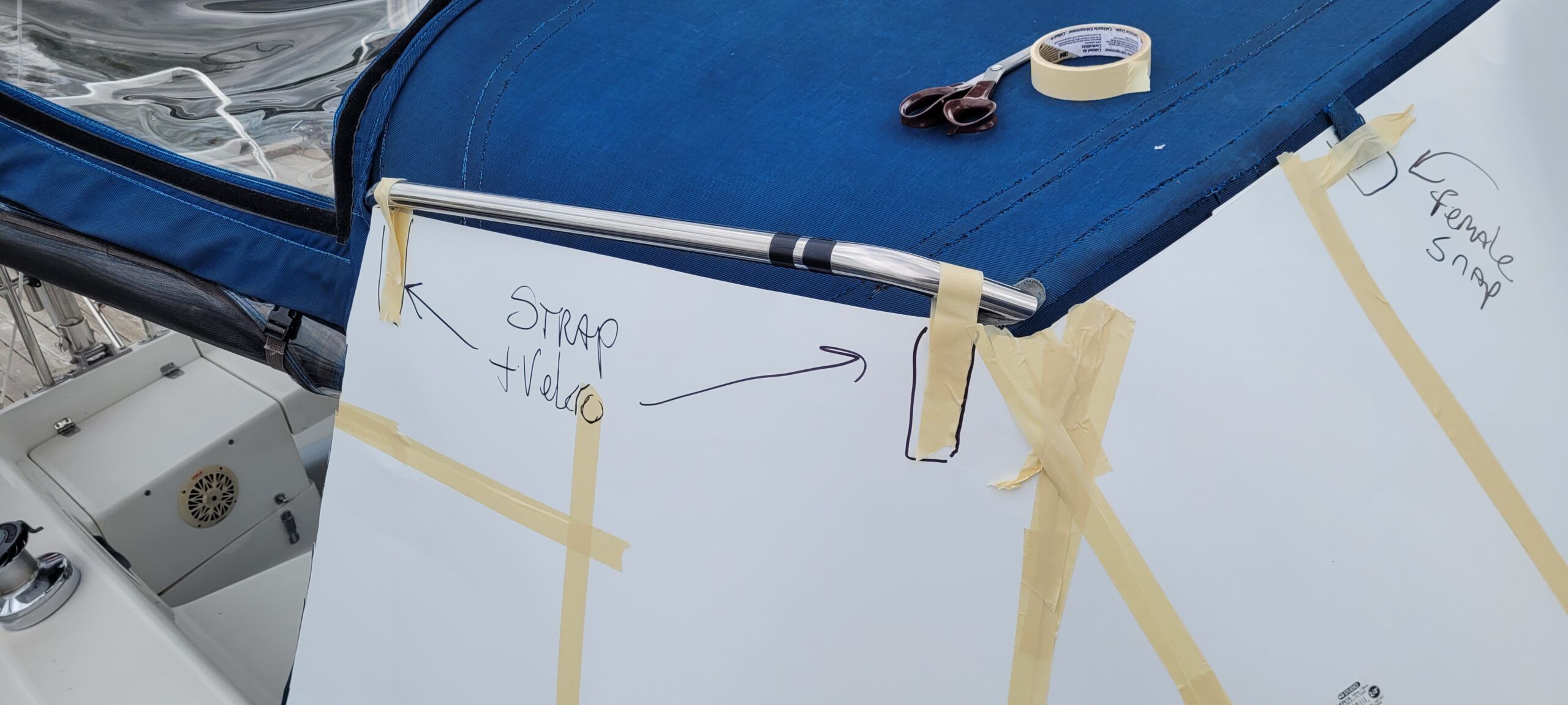 Mark the points where you wants straps installed with sharpie and pieces of tape. Also mark where you need snaps placed. (Photo/ Marc Robic)