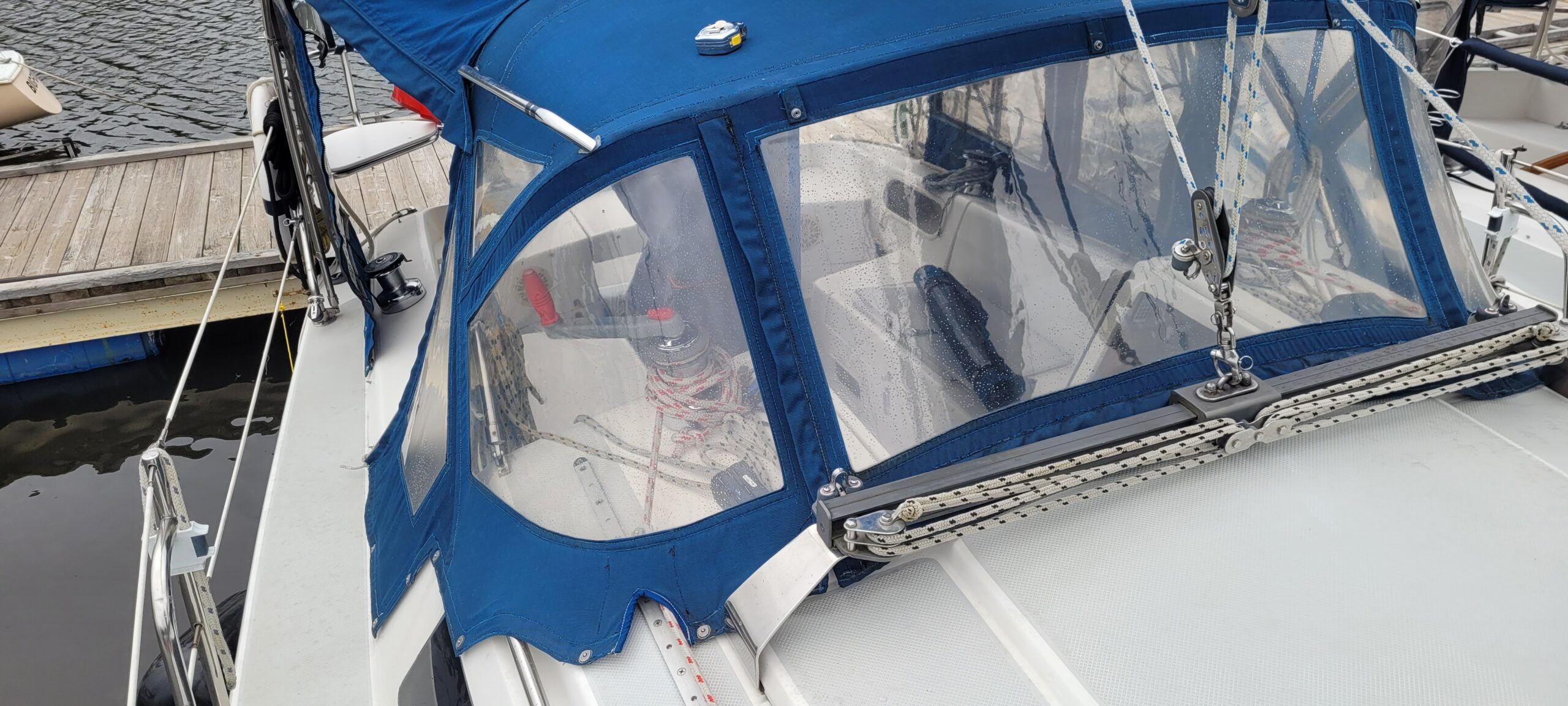 A clear dodger window is essential for safe navigation and enjoying your sail. To extend the life of your windows, a physical canvas cover is your best option. While a cover does present an initial upfront cost, it is cheaper than buying all new windows more often. (Photo/ Marc Robic)