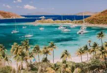 Bareboat Chartering Basics: Charter Companies and Planning Tips Deadman's Bay on Peter Island, British Virgin Islands (BVIs), Caribbean. Sailing the beautiful warm Caribbean Sea can truly be one the most memorable experiences and the BVIs are great for less experienced sailors. (Photo/ Brooke Darling/ Getty)