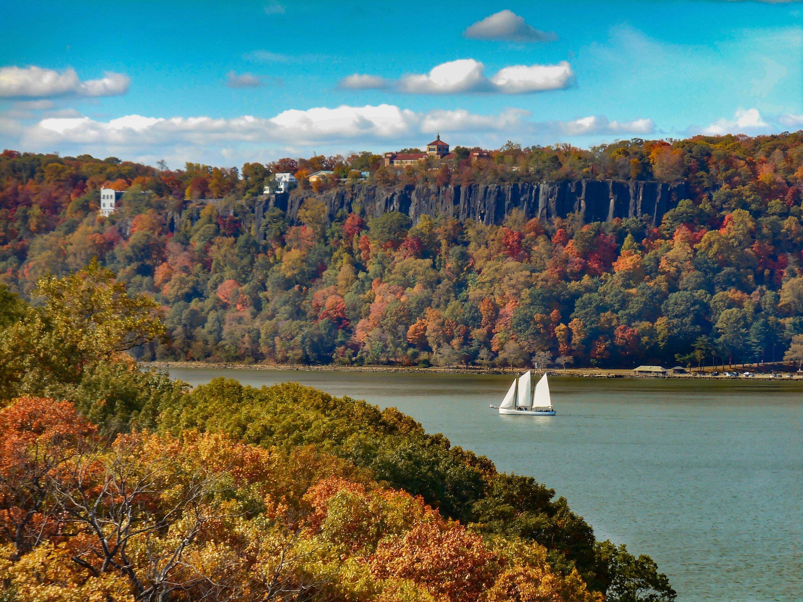 Sailing on the river is a welcome break from the bustle on shore, and is magical with the leaf change in fall. Hudson River Palisades in autumn. (Photo/ Robert L. Phillips/ Getty)