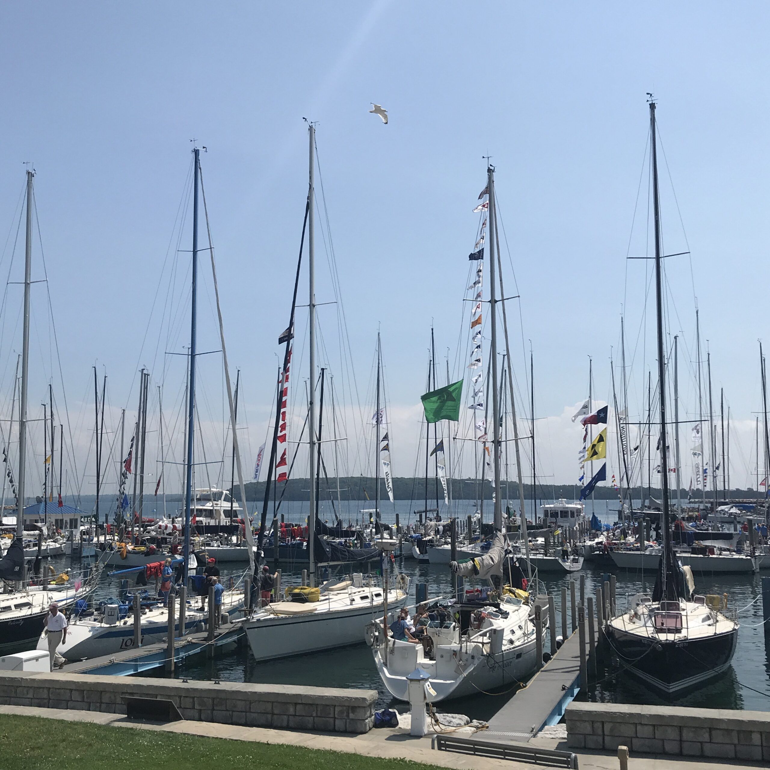 The Great Lakes are a wonderful cruising ground. In your budget, make sure you allocate funds for transit mooring to allow you to explore harbor towns. This is taken on the lawn in front of Mackinac Harbor after the Race to Mackinac. (Photo/ Nick Van Antwerp) 