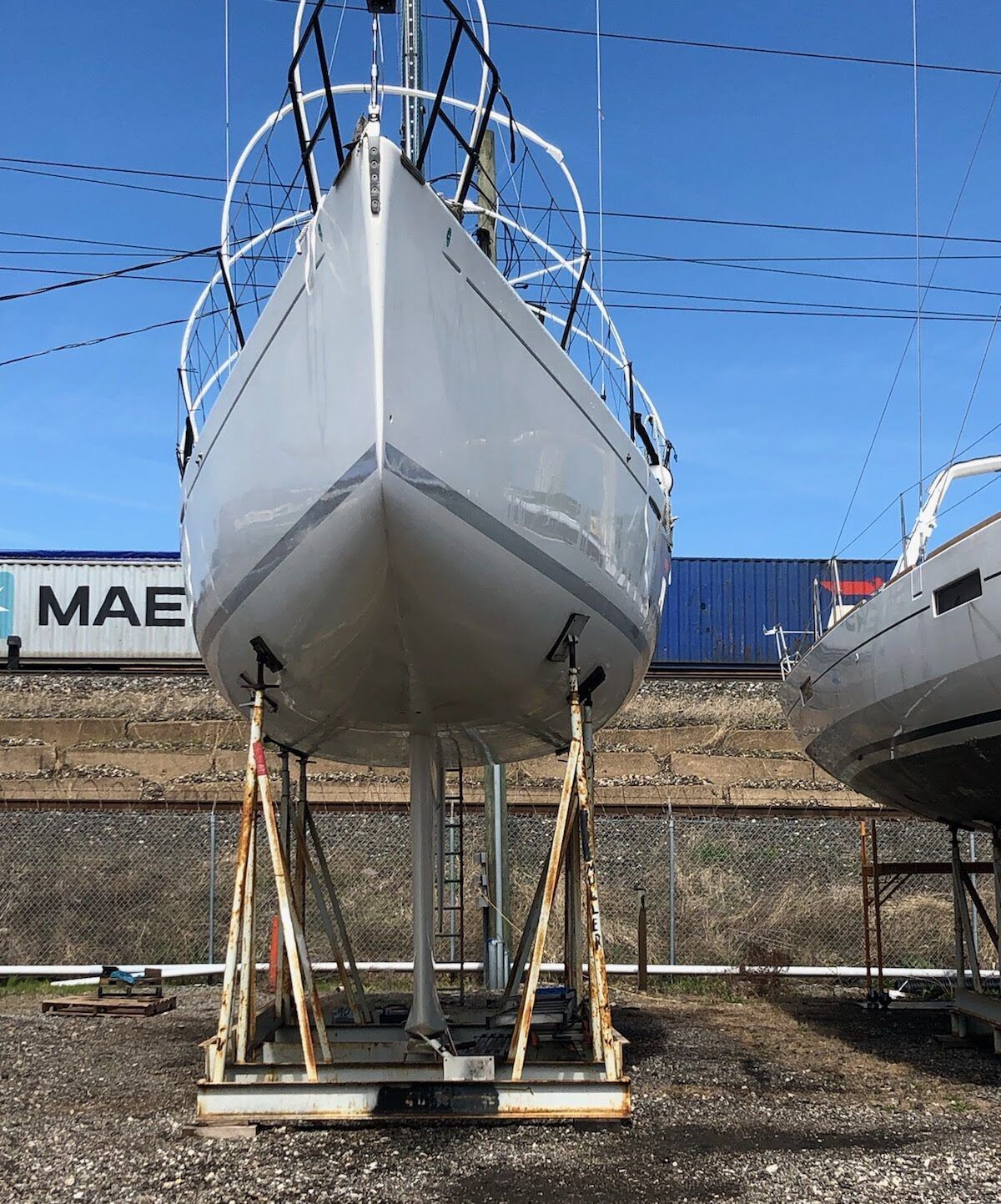 Beneteau 40.7 emerging from its winter shrink wrap storage. You can see the white PVC hoops on the deck of the boat that are used to give the shrink wrap some structure. (Photo/ Nick Van Antwerp)