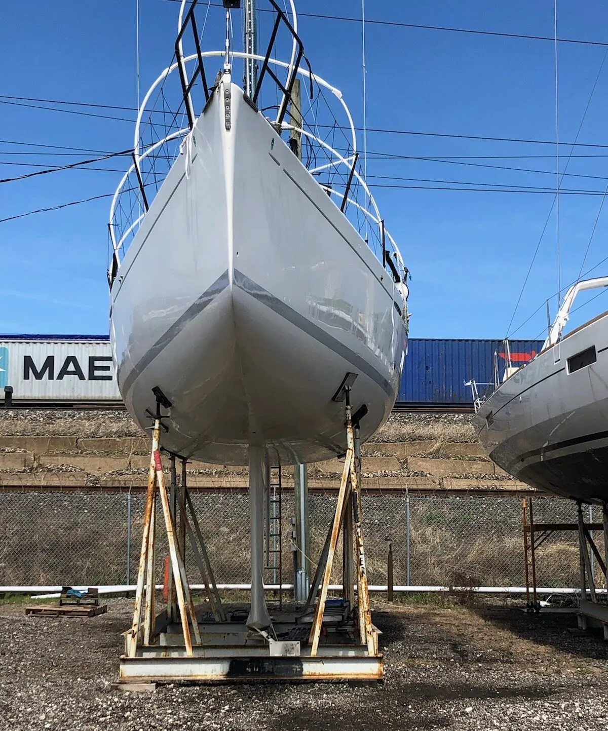 Beneteau 40.7 emerging from its winter shrink wrap storage. You can see the white PVC hoops on the deck of the boat that are used to give the shrink wrap some structure. (Photo/ Nick Van Antwerp)