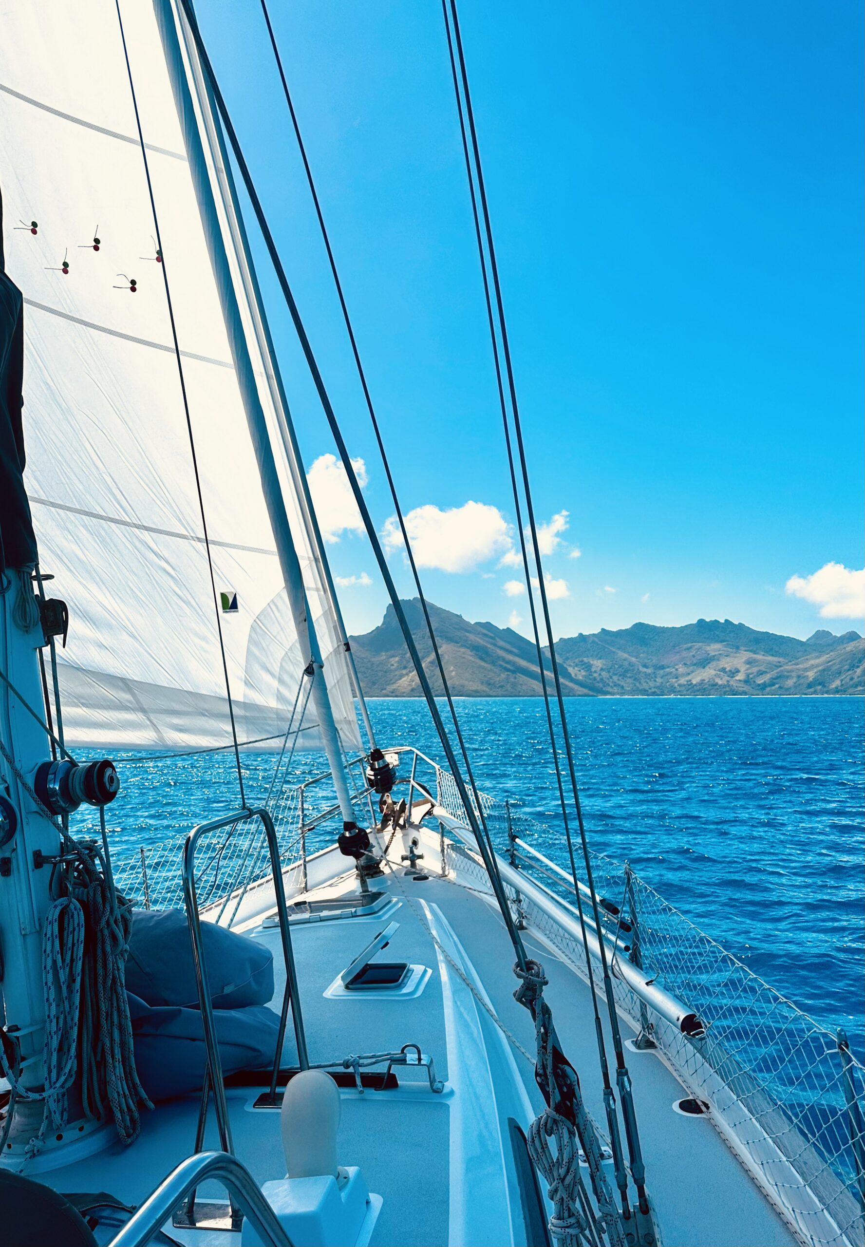 Under passage in the Pacific. It's always a gorgeous day when there are no repairs to attend to. Make sure you have spares aboard for when things do break (because they will). Depending on where you are located, it is often difficult to receive spare parts or find the necessary tools, which is why its helpful to have friends the next boat over! (Photo/ Viki Moore)