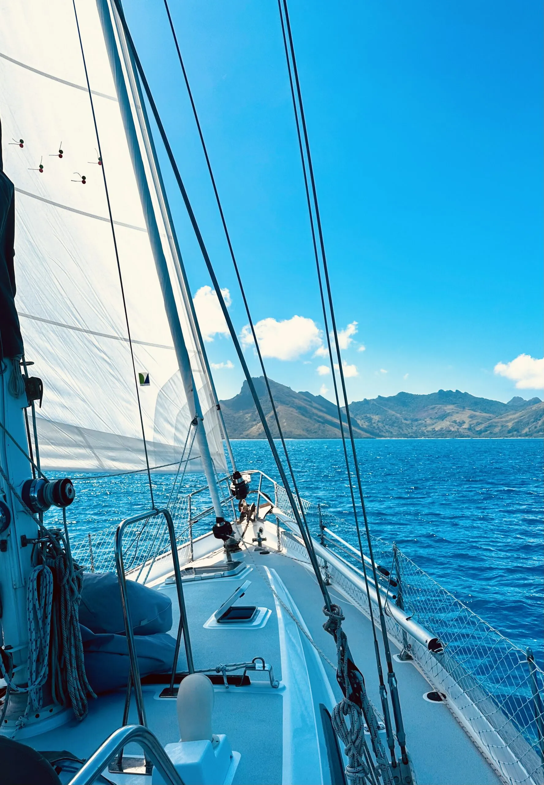 Under passage in the Pacific. It's always a gorgeous day when there are no repairs to attend to. Make sure you have spares aboard for when things do break (because they will). Depending on where you are located, it is often difficult to receive spare parts or find the necessary tools, which is why its helpful to have friends the next boat over! (Photo/ Viki Moore)