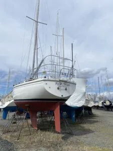 Rock Steady in the boatyard in spring. Yearly haul outs before winter do add to your costs, but it is also a great opportunity to do maintenance work. (Photo/ Kim Saylor)