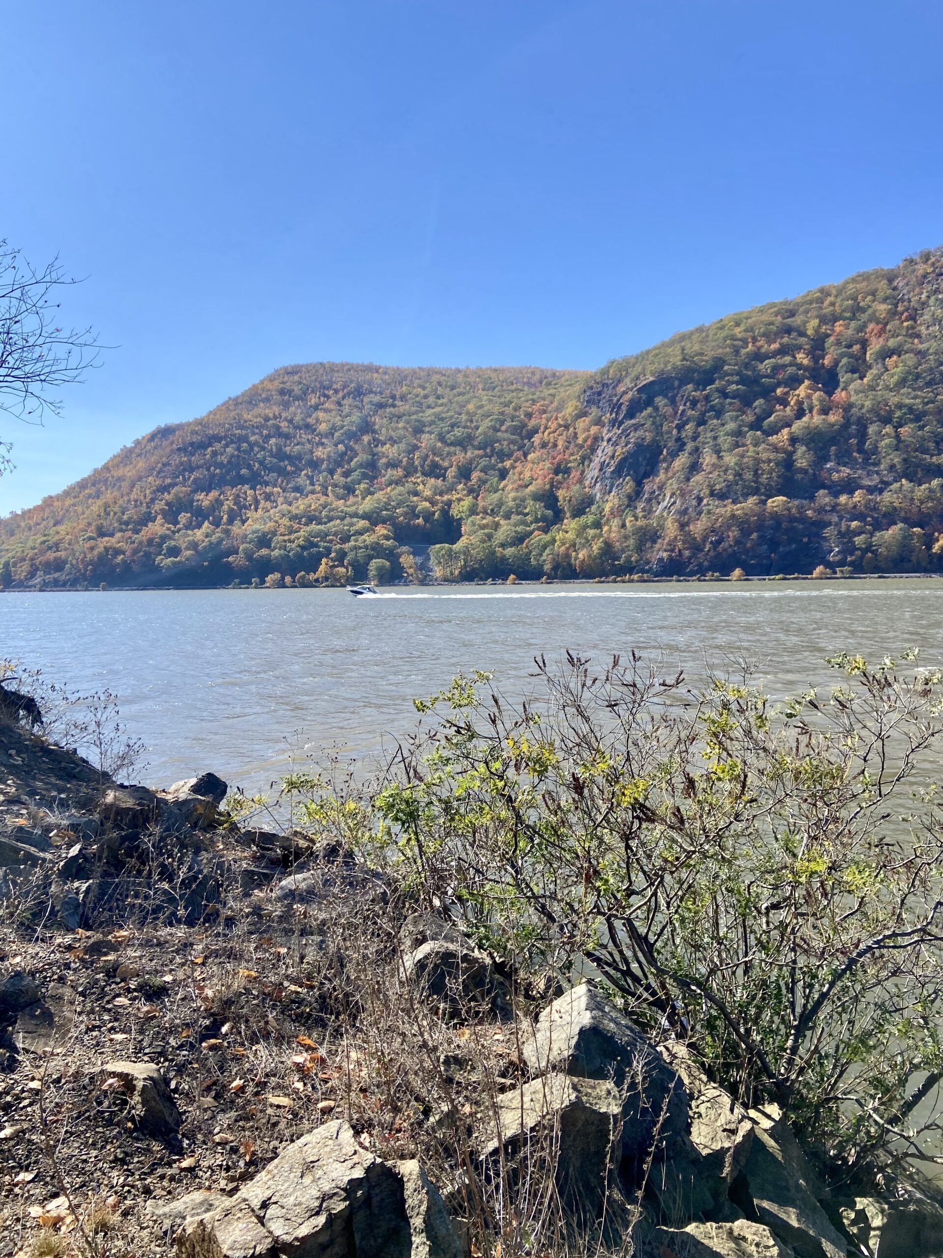 A view of the Hudson River from the shore, south of Little Stony Point, NY. The lower part of the Hudson River is a tidal estuary which means we have high and low tides. Tide heights are usually not high, although whitecaps on the Hudson do occur. The current is more of a consideration as it can be strong and can affect cruising speed, especially if under power. (Photo/ Kim Saylor)