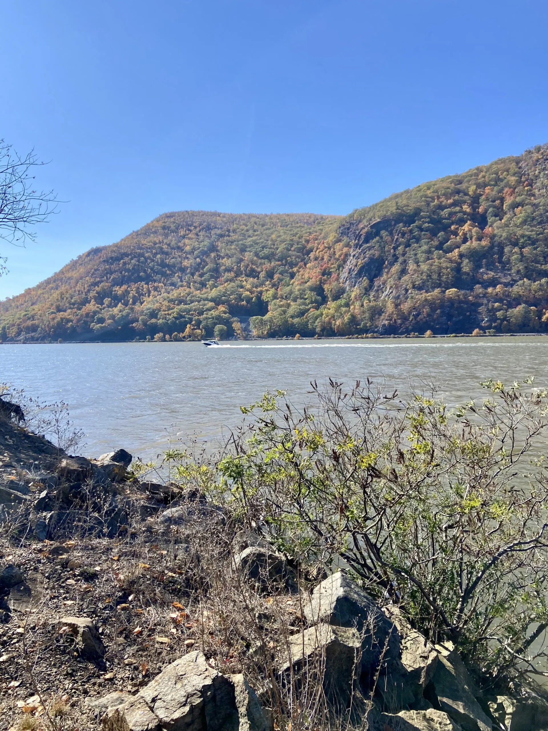 A view of the Hudson River from the shore, south of Little Stony Point, NY. The lower part of the Hudson River is a tidal estuary which means we have high and low tides. Tide heights are usually not high, although whitecaps on the Hudson do occur. The current is more of a consideration as it can be strong and can affect cruising speed, especially if under power. (Photo/ Kim Saylor)