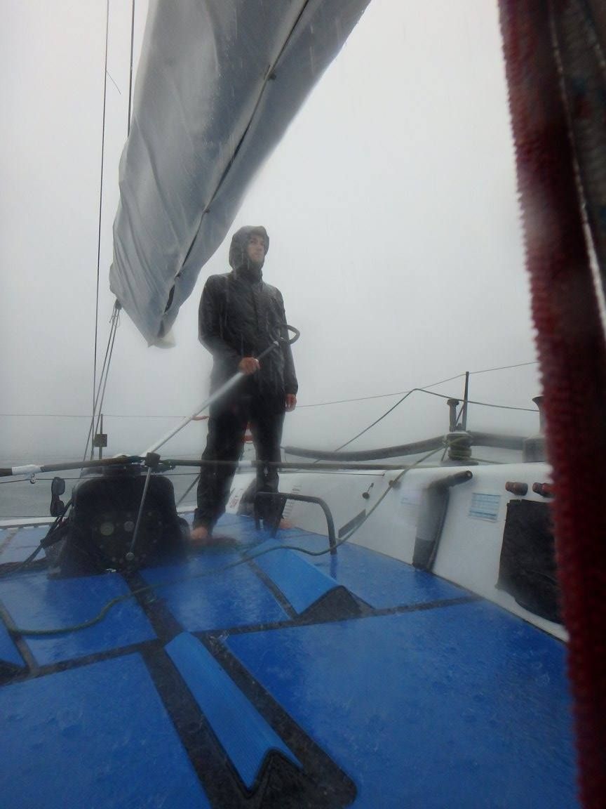 The author at the helm—not his usual post—on a Farr 40 for the Verve Cup regatta in 2016. A small storm was about to blow through the racecourse and racing was postponed. We dropped the sail and crew headed down below, I volunteered to stay on deck. After this shot, the storm intensified, visibility dropped and we were running from the storm. The rain was so vicious that even in the diminished light from the clouds, I put sunglasses on so I could keep my eyes open against the bite of the rain in order to see our compass heading. The skipper came on deck with me as we were blown towards land, while the crew watched the chart plotter down below to make sure we were not getting close to vessels or break walls—we could hardly see to the bow pulpit. (Photo/ Nick Van Antwerp)
