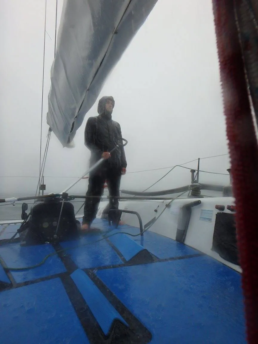 The author at the helm—not his usual post—on a Farr 40 for the Verve Cup regatta in 2016. A small storm was about to blow through the racecourse and racing was postponed. We dropped the sail and crew headed down below, I volunteered to stay on deck. After this shot, the storm intensified, visibility dropped and we were running from the storm. The rain was so vicious that even in the diminished light from the clouds, I put sunglasses on so I could keep my eyes open against the bite of the rain in order to see our compass heading. The skipper came on deck with me as we were blown towards land, while the crew watched the chart plotter down below to make sure we were not getting close to vessels or break walls—we could hardly see to the bow pulpit. (Photo/ Nick Van Antwerp)