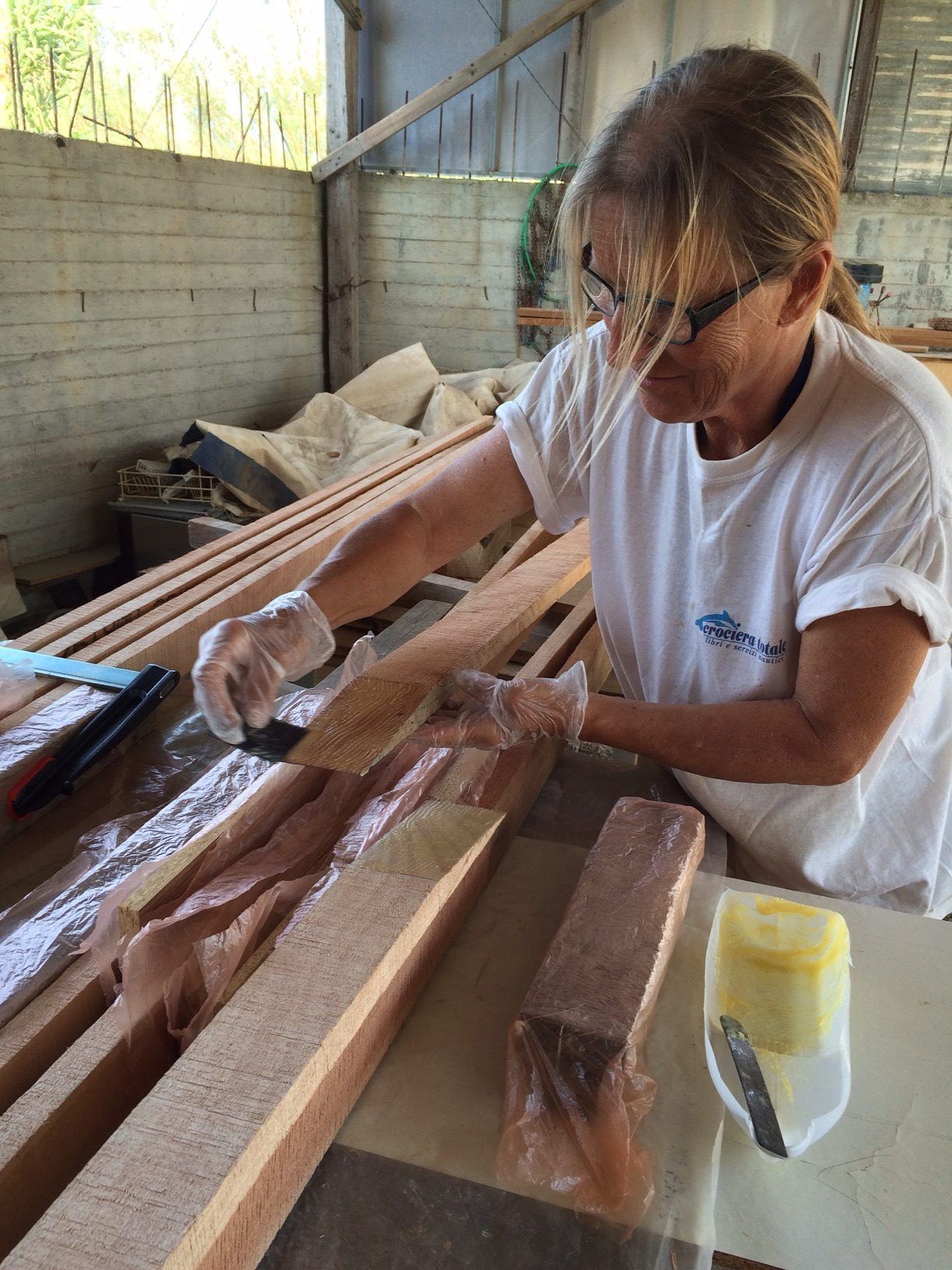 Gluing the scarf joints. After the glue has set, the timber yard will run the slats through the planer to make them to their final size. (Photo/ Wharram Designs)