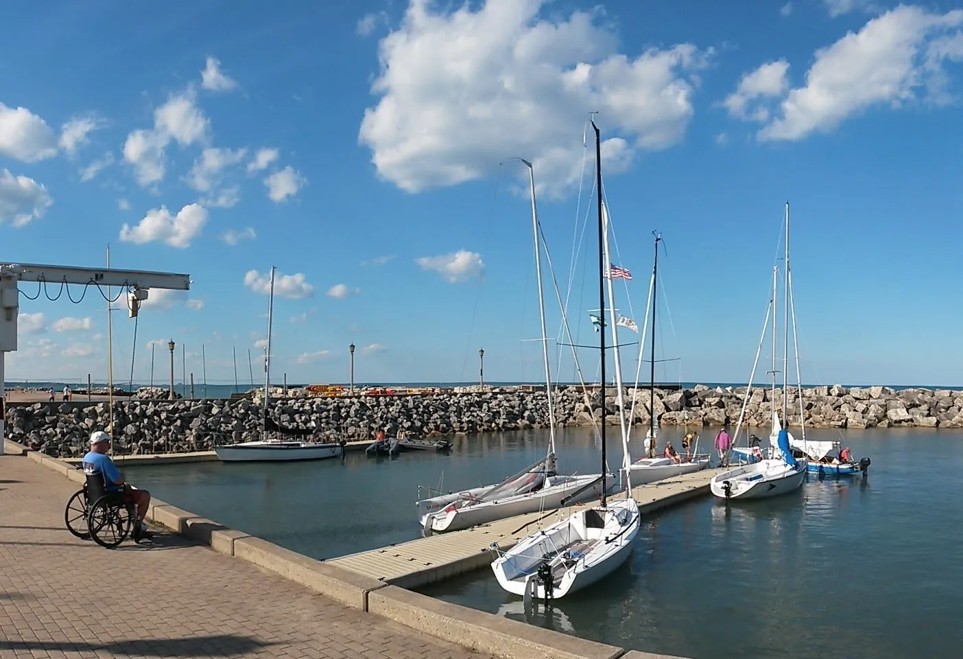 If you store vessels on dry land and go day sailing, some locations offer a crane to get the boat into the water. This is the harbor in Lake Forest north of Chicago, however these facilities can also be found in Belmont and Montrose Harbor in Chicago, and Wilmette Harbor closer to the city. The boat on the far left dock with a black sail cover is the formerly raccoon-infested Merit 25 from Wisconsin. (Photo/ Nick Van Antwerp)