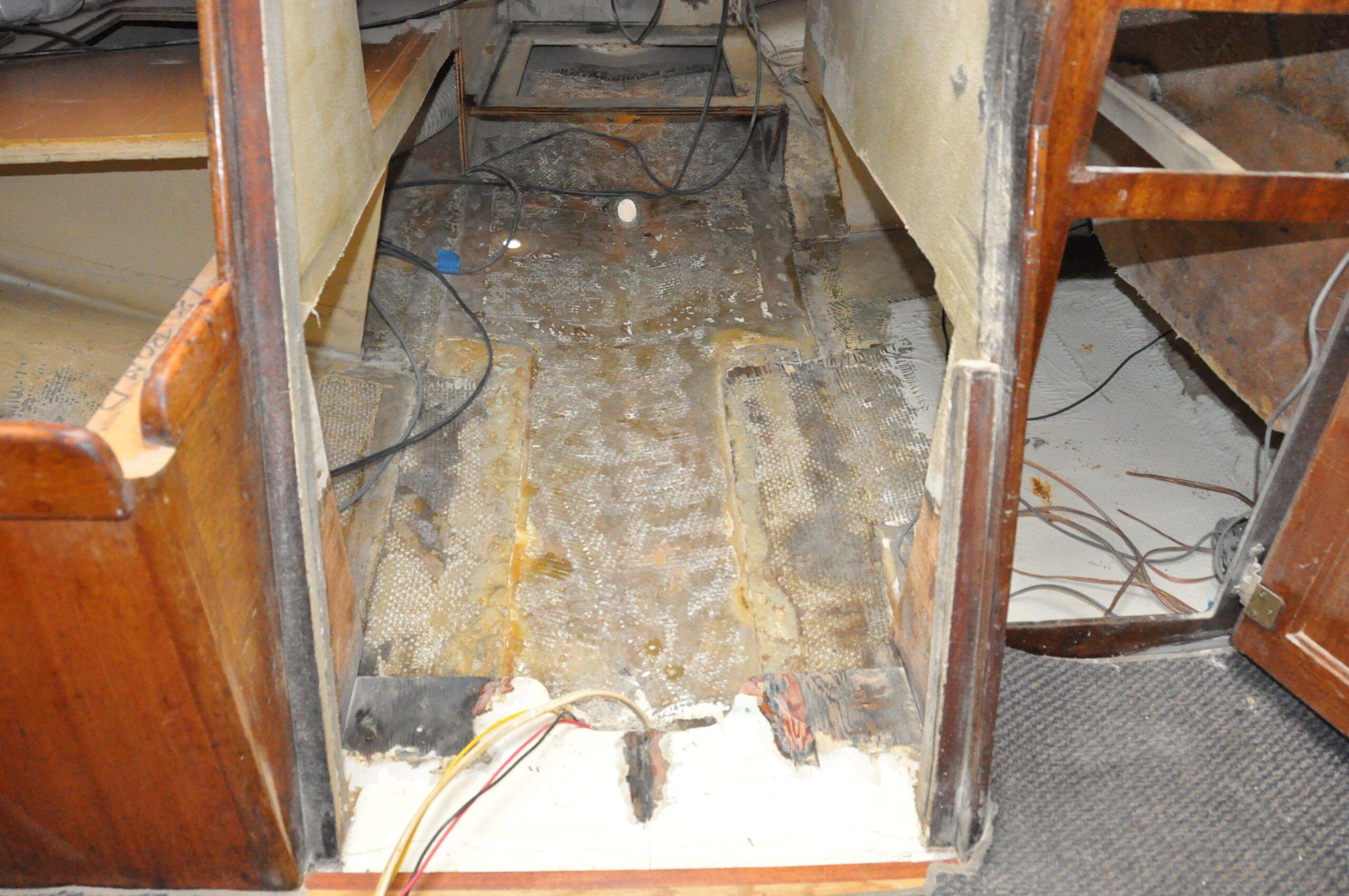 To accomodate the Beta 20's wider engine bed, the old cabinetry was removed and new fiberglass applied inside, with additional fairing applied on the hull. (Photo/ Bert Vermeer)