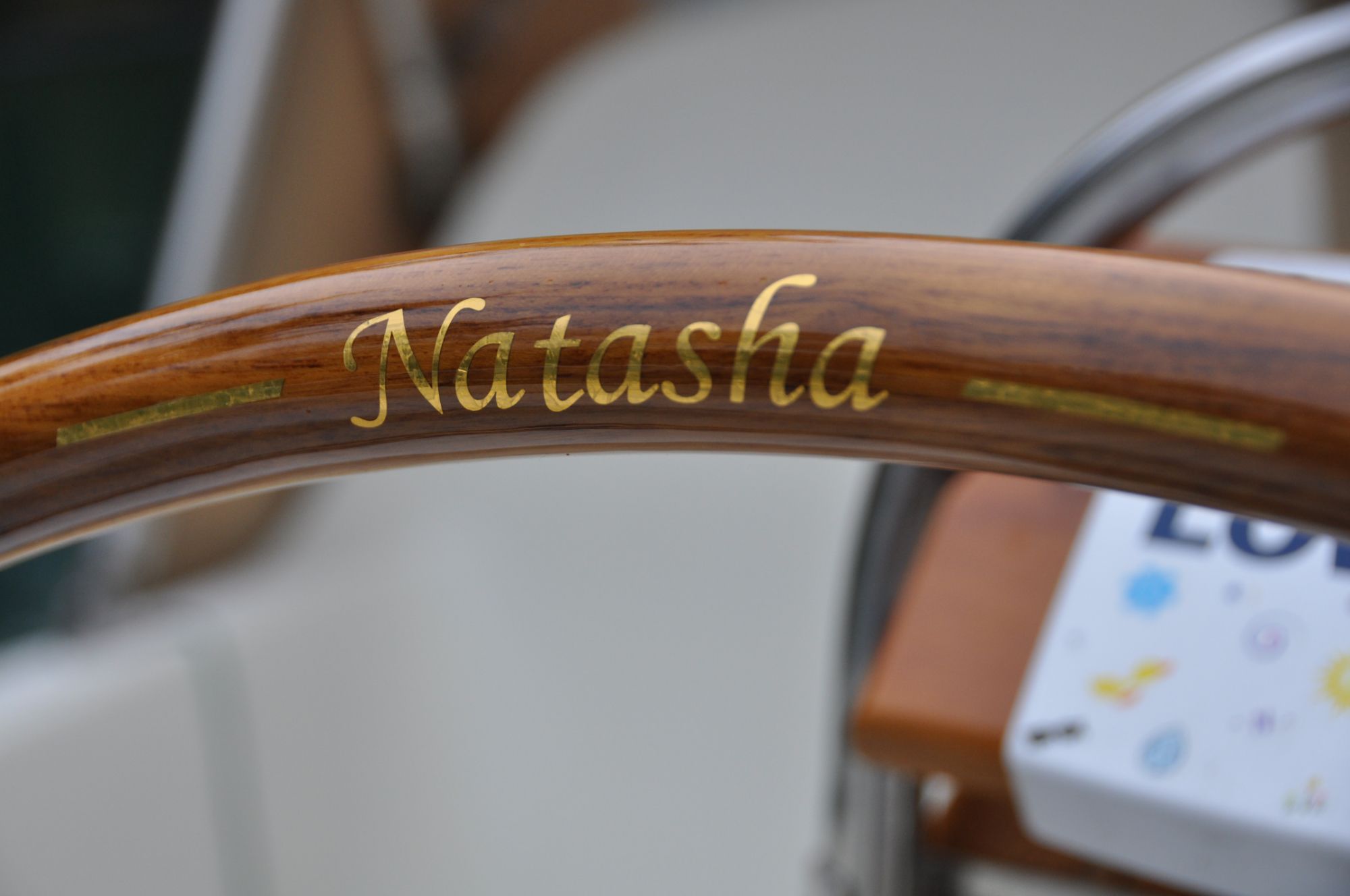 Imitation gold leaf highlights the boat name against the warm wood. (Photo/ Bert Vermeer)