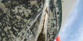 Although the cause of this delaminated rudder is unknown, In most cases the delamination comes with age. Also, a small nick from hitting a rock or coral will let water in and, if not attended too, the delamination will worsen in time. (Photo/ Ray Ville)