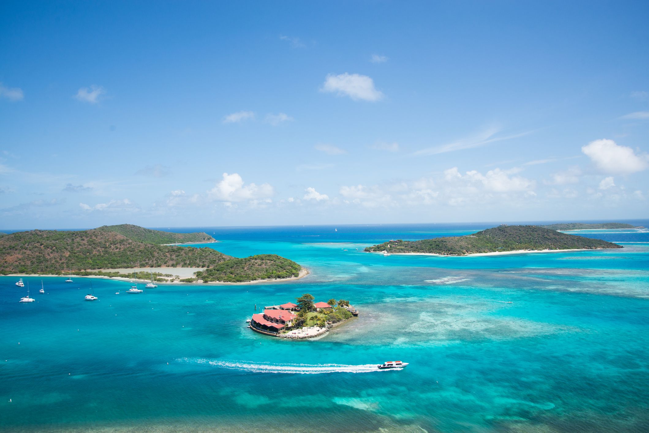 Boats safely moored near famous Saba Rock, Gorda Sound, Virgin Gorda. (Photo/ Caleb Troy/ Getty)