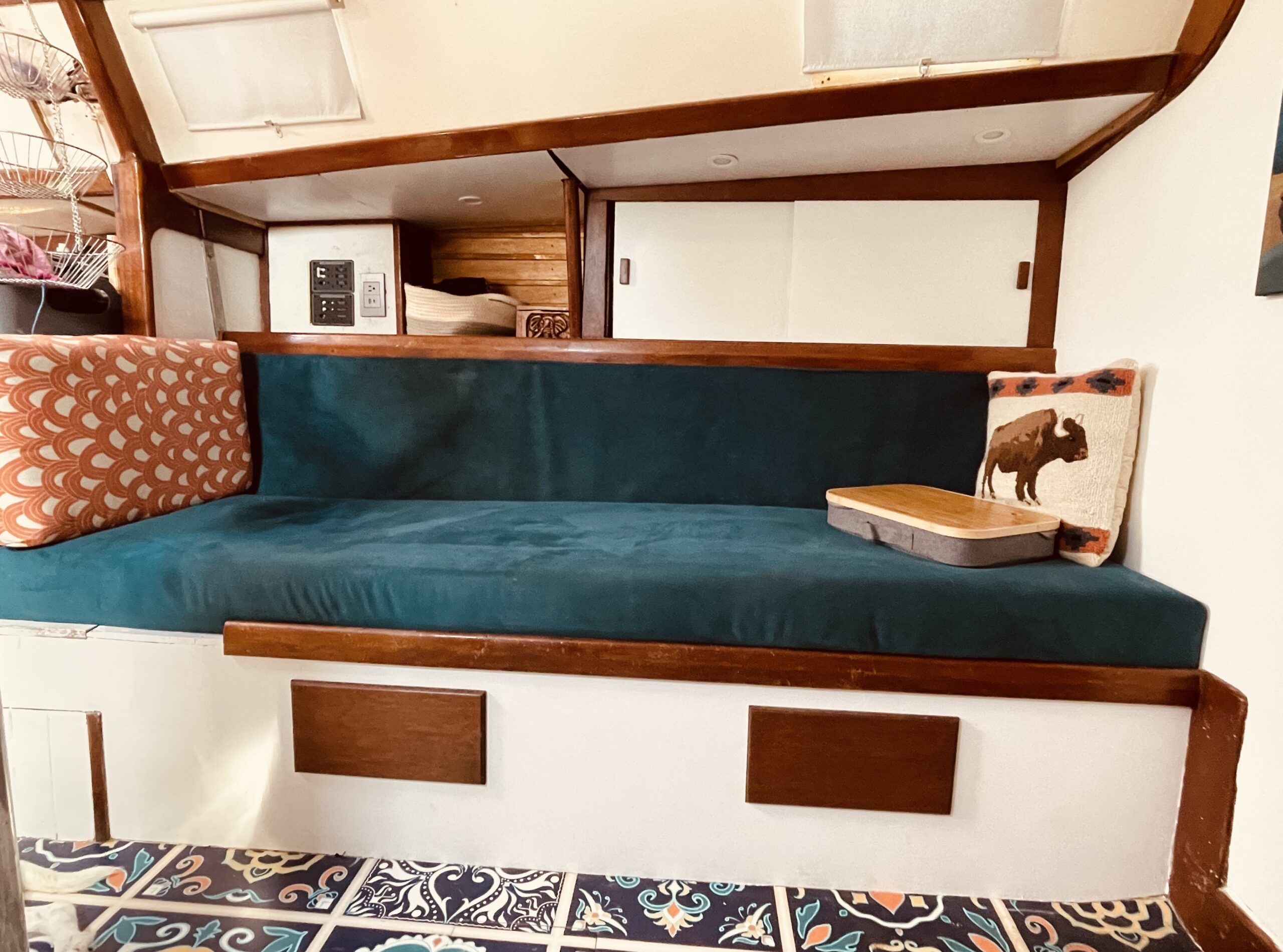 The starboard settee after the refit with the extended settee in place. (Photo/ Jaclyn Jeffrey)