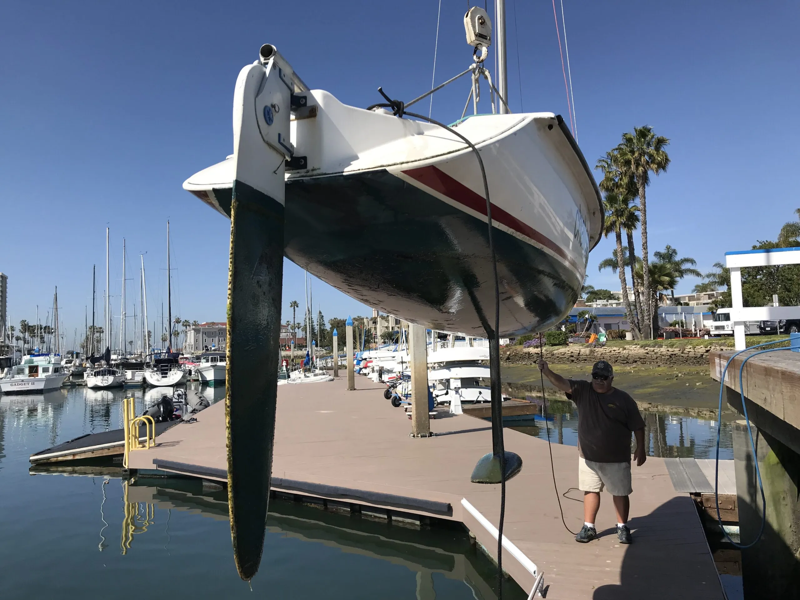 Challenged Sailors San Diego hoists the Martin 16 out of the water with the keel fully deployed, then rests the boat in a trailer, where the trailer takes the boat's weight without damaging the keel. (Photo/ Craig Dennis)