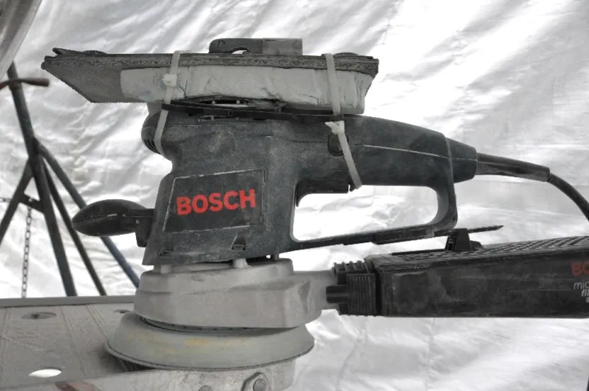 To overcome the curved top of the sander, carve a foam block to that curve, so the surface becomes a flat attachment point for the flat metal sanding head. (Photo/ Bert Vermeer)