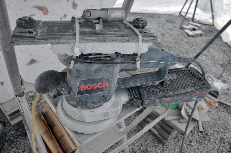 The set up, with the zip ties securing the metal sanding head to the foam block atop the orbital sander. (Photo/ Bert Vermeer)